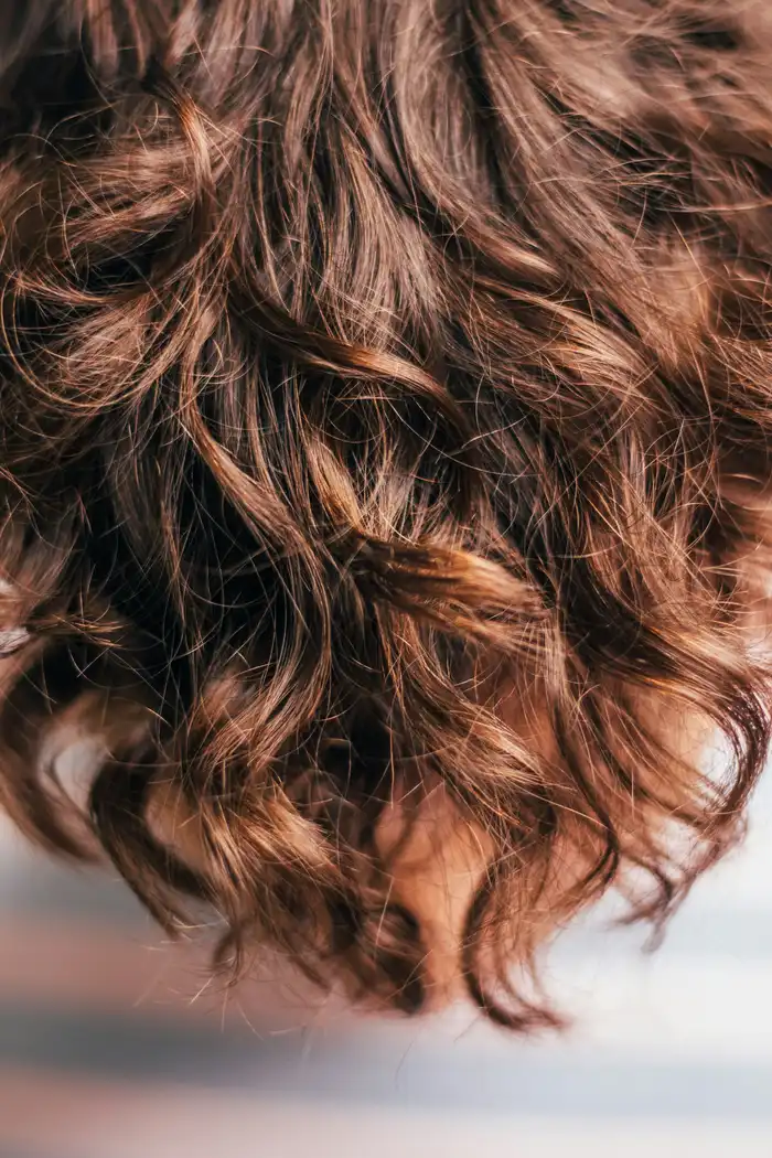Close-up of smooth, glossy, healthy hair after a keratin treatment
